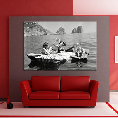 Floating Luncheon Canvas Wall Art | Three young women eat spaghetti on inflatable mattresses at Lake of Capri 1939 - PPL11