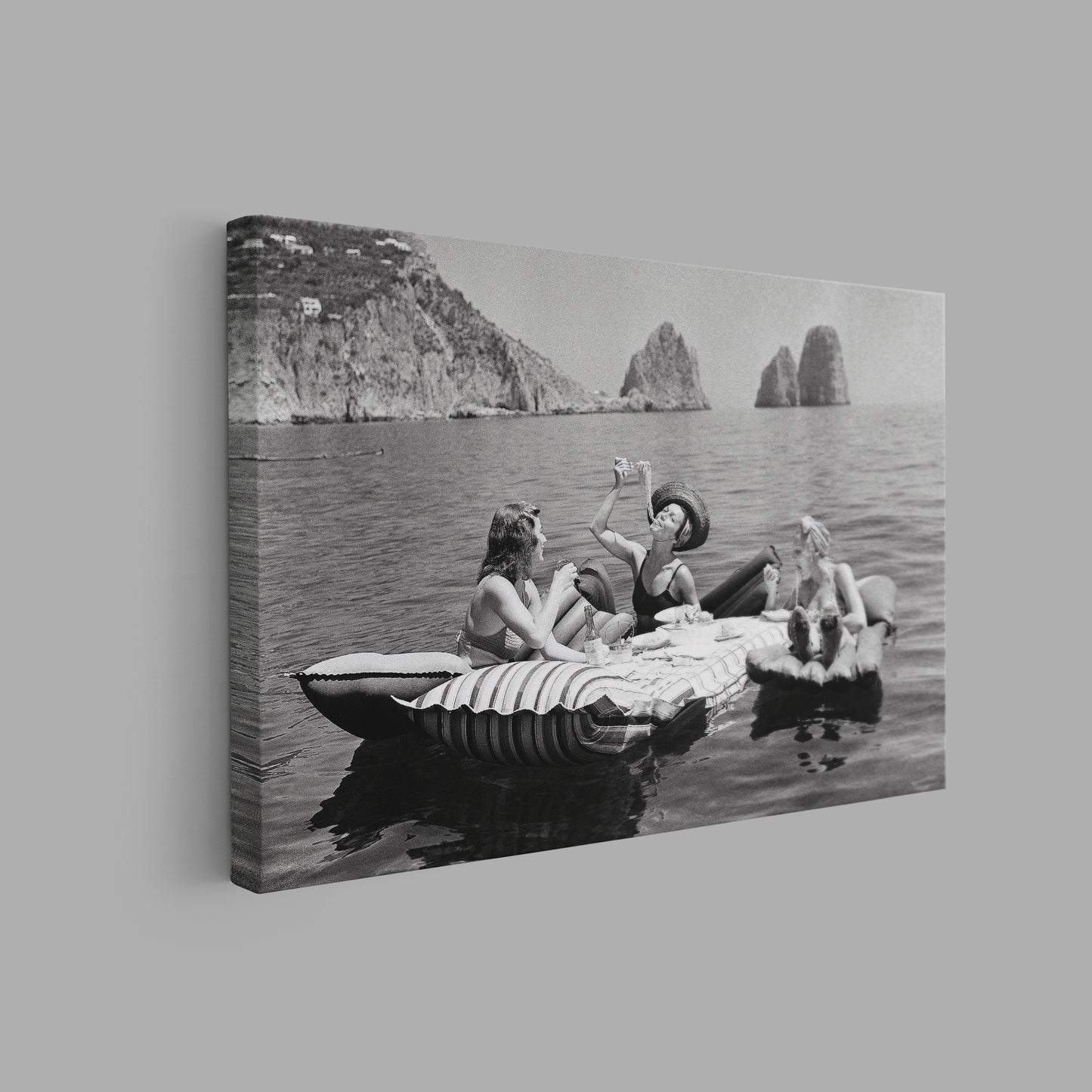 Floating Luncheon Canvas Wall Art | Three young women eat spaghetti on inflatable mattresses at Lake of Capri 1939 - PPL11