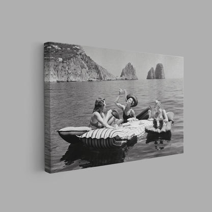 Floating Luncheon Canvas Wall Art | Three young women eat spaghetti on inflatable mattresses at Lake of Capri 1939 - PPL11